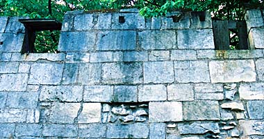 Crenellated precinct wall