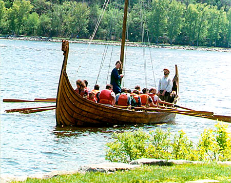 Reconstructed Viking ship draws in to the bank of 
the Ottawa River; photo &copy; S. Alsford